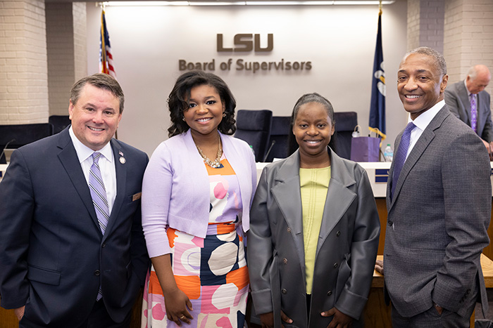 Alcina standing with three of her peers at the LSU Board of Speakers.