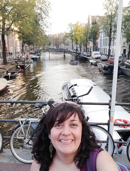 Consuelo posing on a bridge over a canal