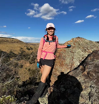 Helene trekking in mountains.