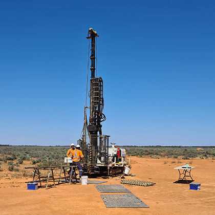 Josh and a co-worker in the outback working with a geotech machine.