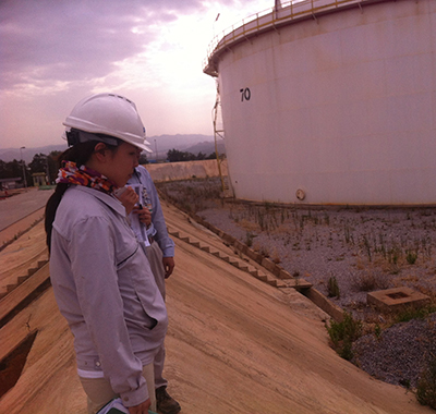 Moah wearing a helmet working outside.