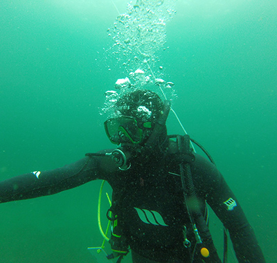 Paul wearing scuba diving equuipment under the water.