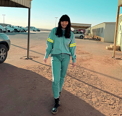 Sainhaa standing outside on site.