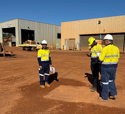 Sunil with other two colleagues in PPE suit at construction site