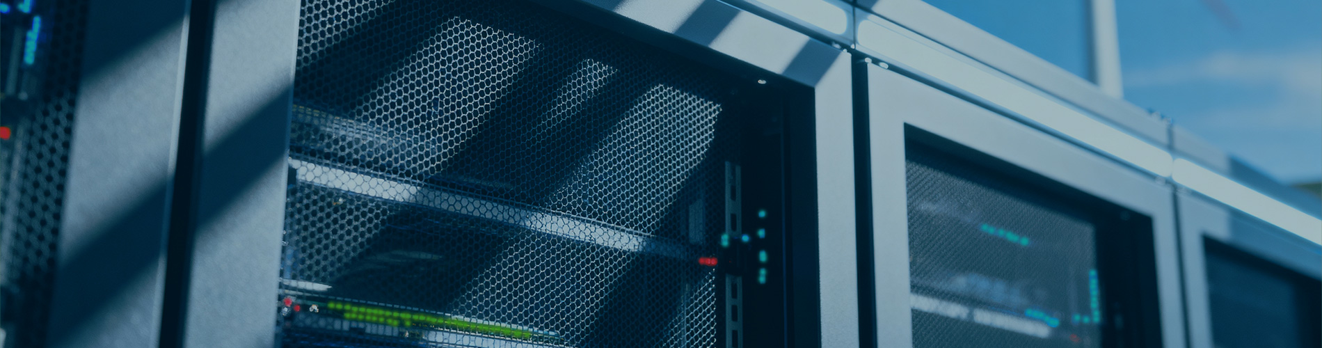 Data server with wind turbine in background.