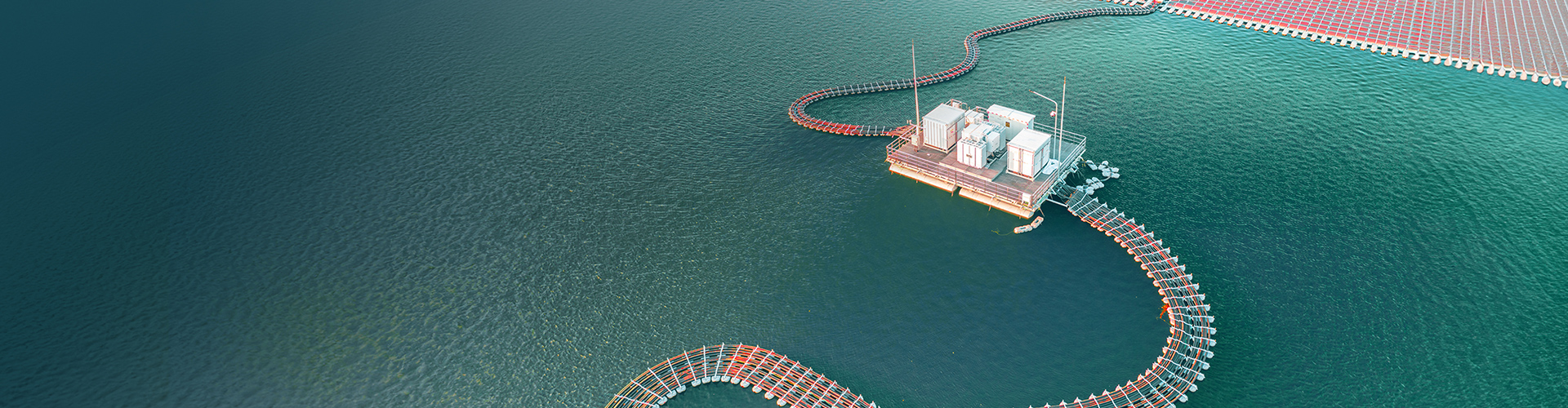 Aerial view of an energy solar power plant on the water.