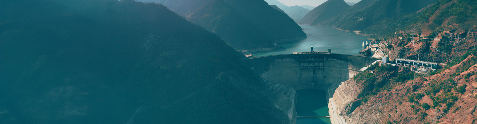 Hydropower plant in the middle of large mountains.