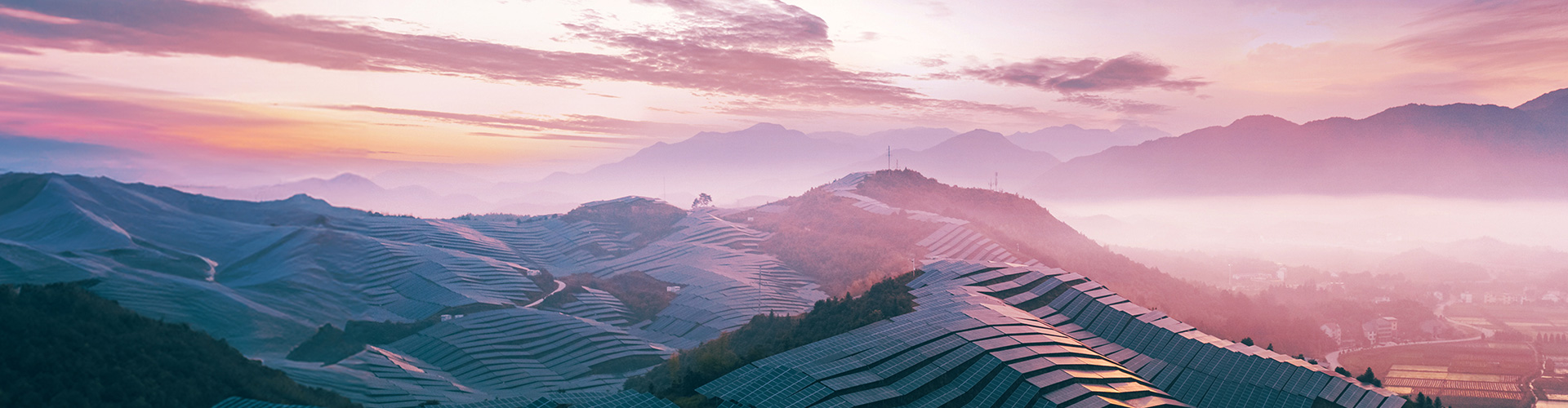 Solar power station on top of mountain range.