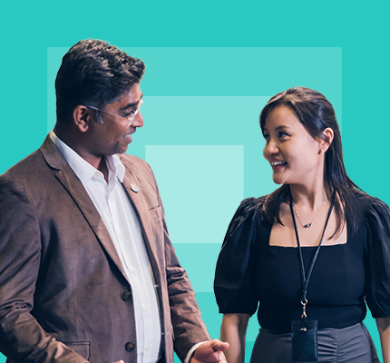 Two Worley people talking to each other.