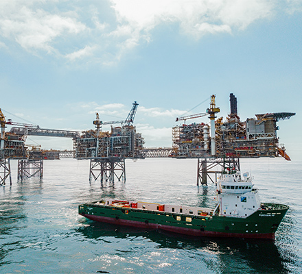 Three offshore platforms with tanker in the Buzzard oil field.