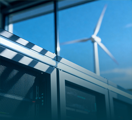 Data server with wind turbine in background.