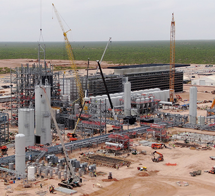 Large-scale industrial facility under construction at a project site.