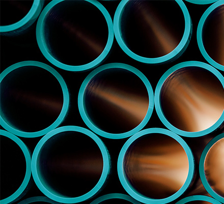 Rows of stacked pipes.