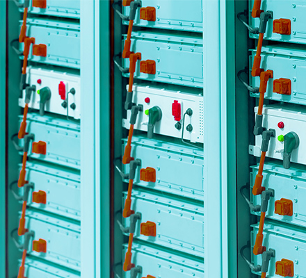 Industrial battery modules with cabling and control switches.