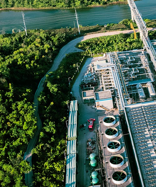 Aerial view of a chemcial plant with rooftops of solar panels.