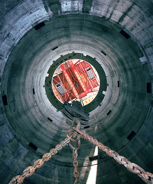 Crane on the inside of a mine shaft.