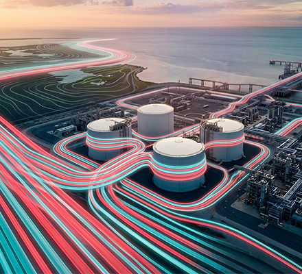 Industrial energy facility with interconnected infrastructure representing integrated energy systems.