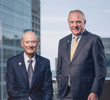 John Grill and Chris Ashton, leaders of Worley standing together in an office.