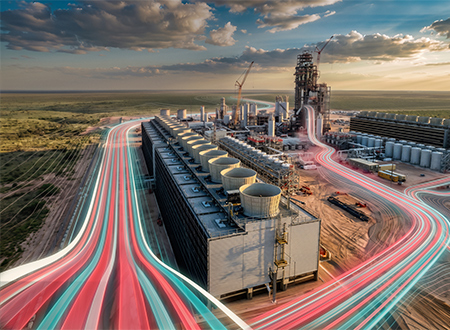 Large energy facility next to a landscape.