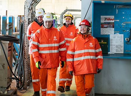 Four Worley Rosenberg people wearing PPE walking together.