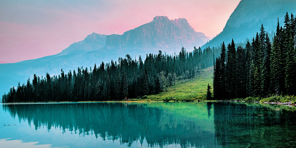 Green forest, mountains and clear lake.