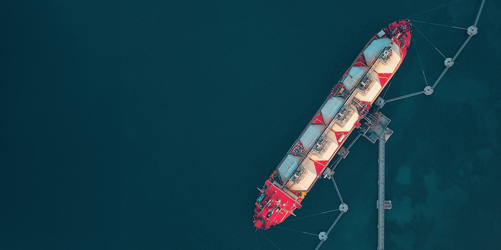 Aerial view of an LNG tanker on the water.