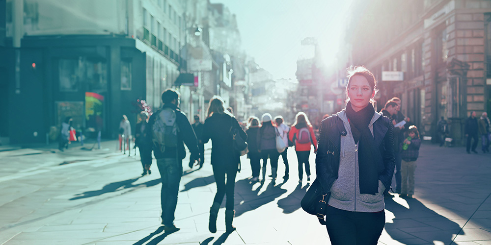 People walking along a city street.