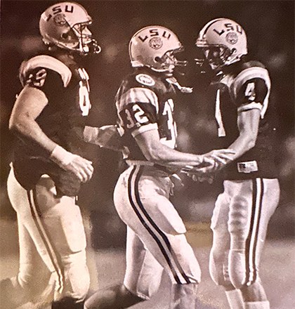 Archival photo of Andy playing football in his early career.