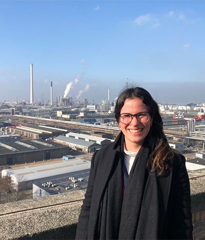 Claudia overlooking a large industrial site.