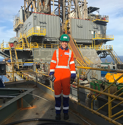 Hannah wearing PPE standing on an offshore platform.