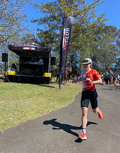 Hannah running along a path.