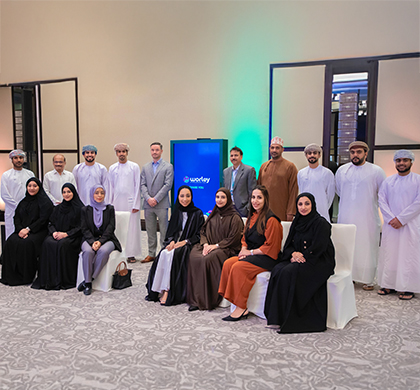 Patrick standing with a group of colleagues from Oman.
