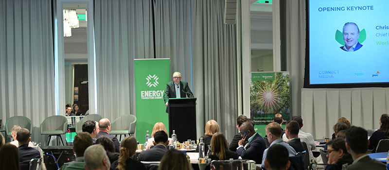 Worley CEO Chris Ashton standing on stage talking to a crowd at the Energy Transition Summit.