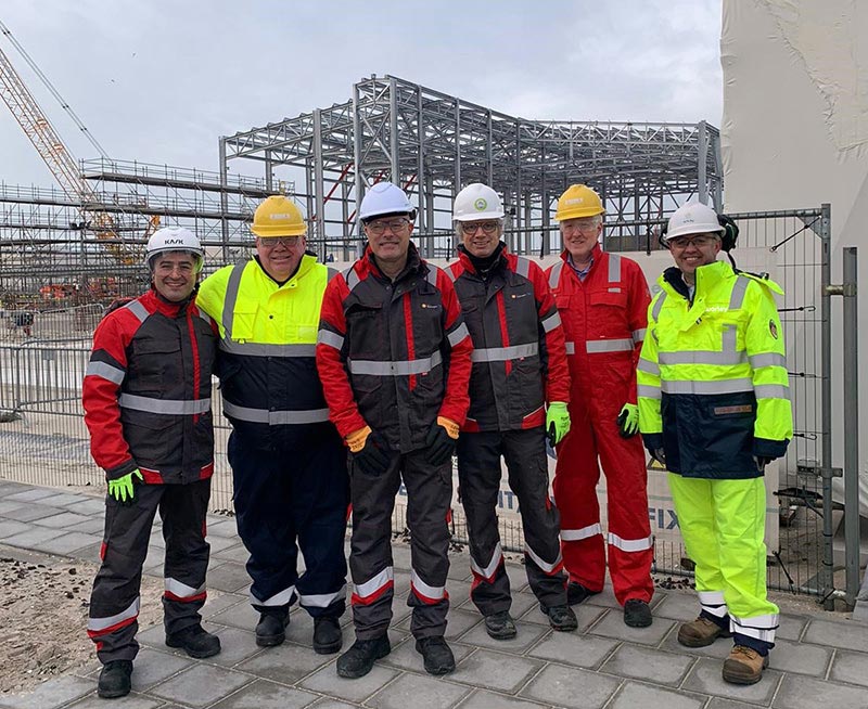 Six people from Shell and Worley standing together at the HH1 site.