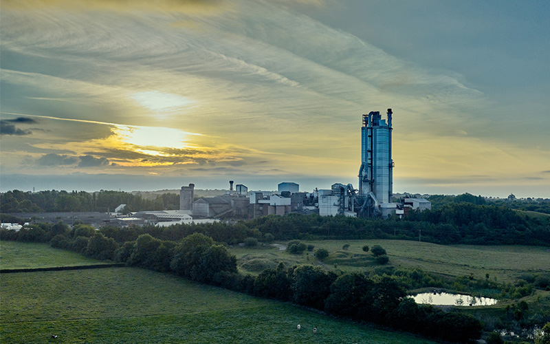 Heidelberg Materials' site situated amongst green fields.