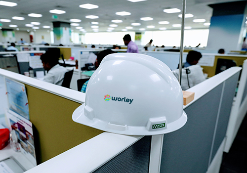 Helmet sitting on top of office partition in Worley's GID office India.