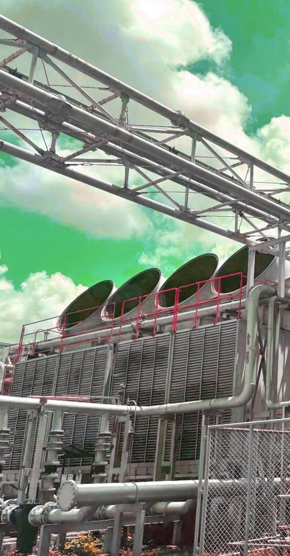 Industrial cooling system with large fan units and metal piping, part of a data center’s infrastructure.